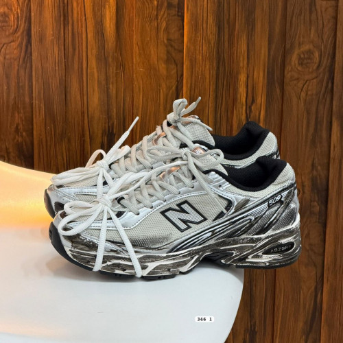 NEW BALANCE GRIS BEIGE PATEADO