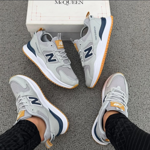 NEW BALANCE GRIS AZUL HOMBRE