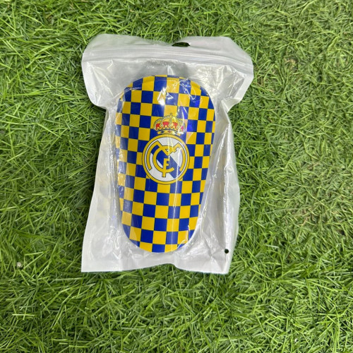 ESPINILLERA REAL MADRID HOMBRE